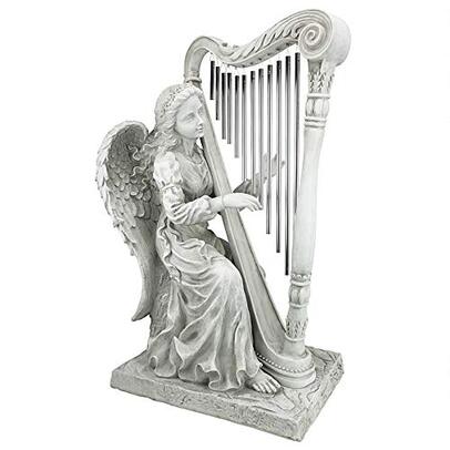 Angel garden statue playing harp